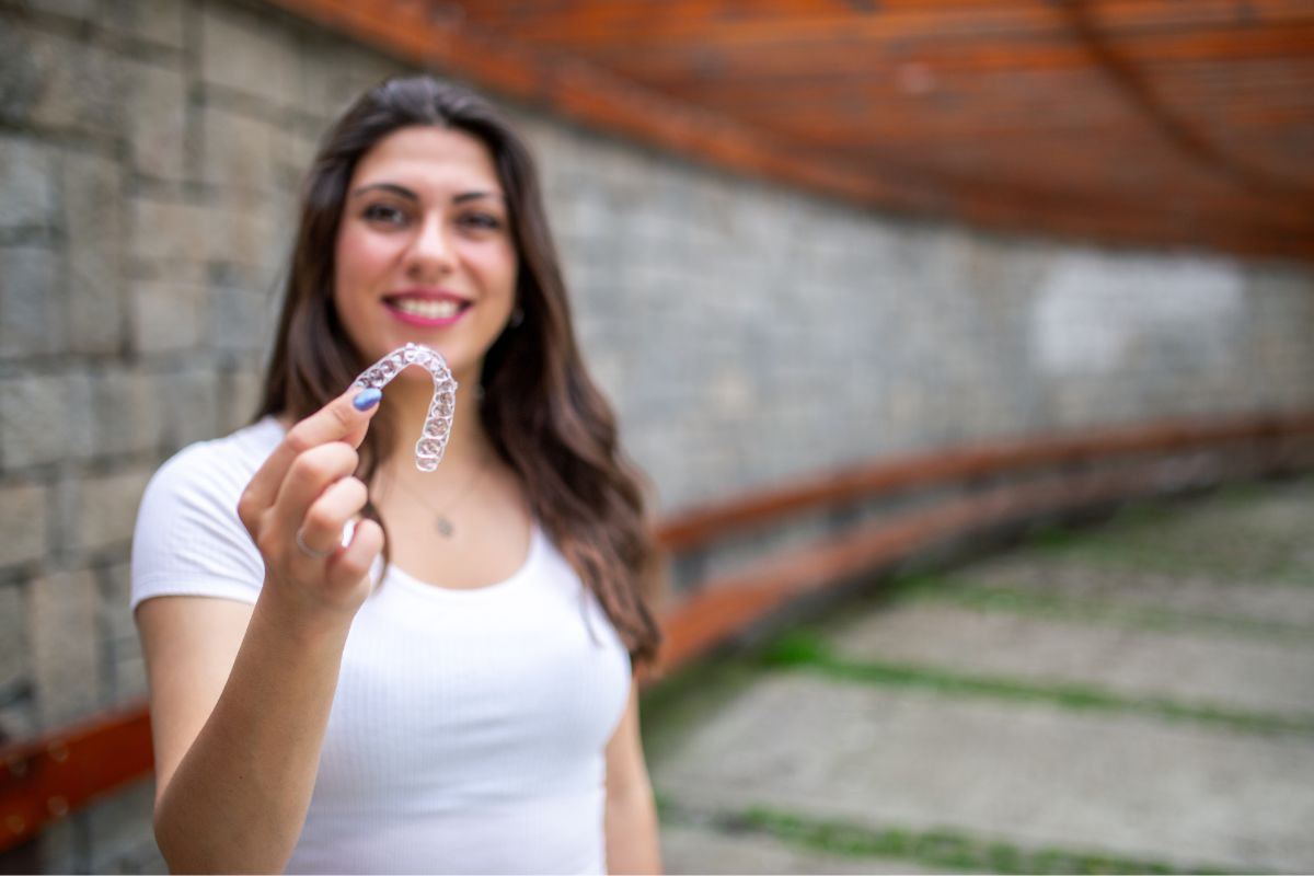 patient holding clear aligner